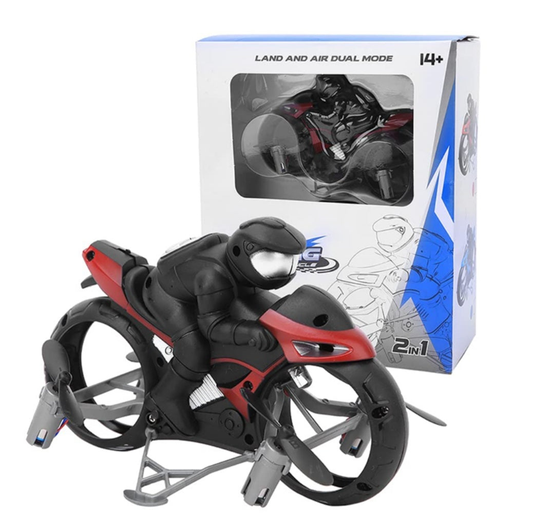 Toy motorcycle with a robot figure on top, in front of its packaging box.